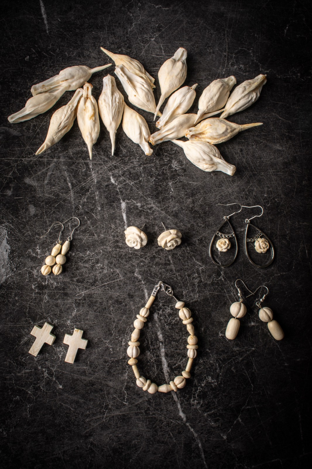 Earrings, bracelets, and pendants carved from carp bone