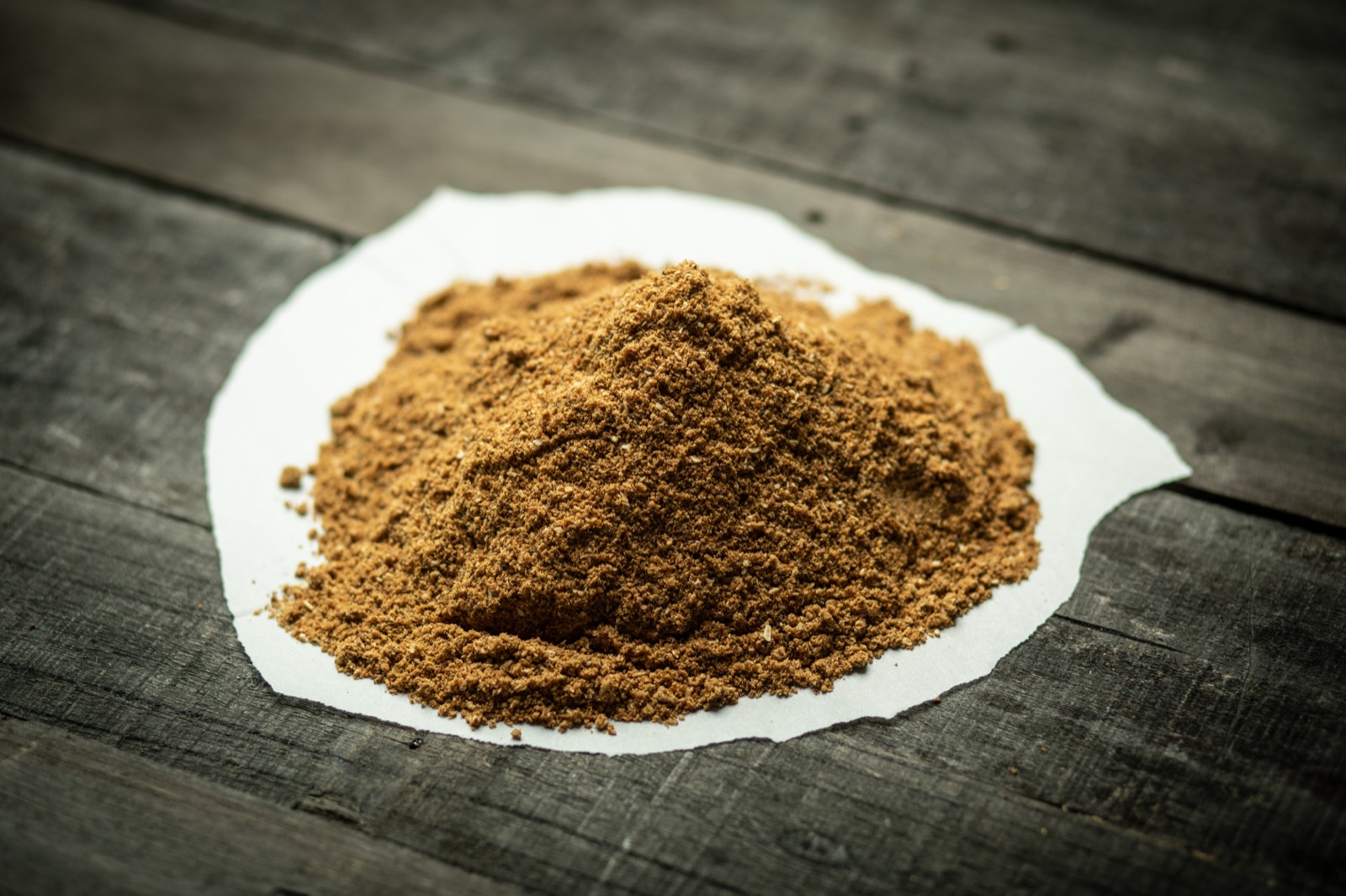 Finely ground fish meal produced from carp processing byproducts